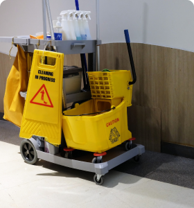 A wagon filled with cleaning equipment