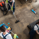 Top view of cleaners working hard in a modern office building.