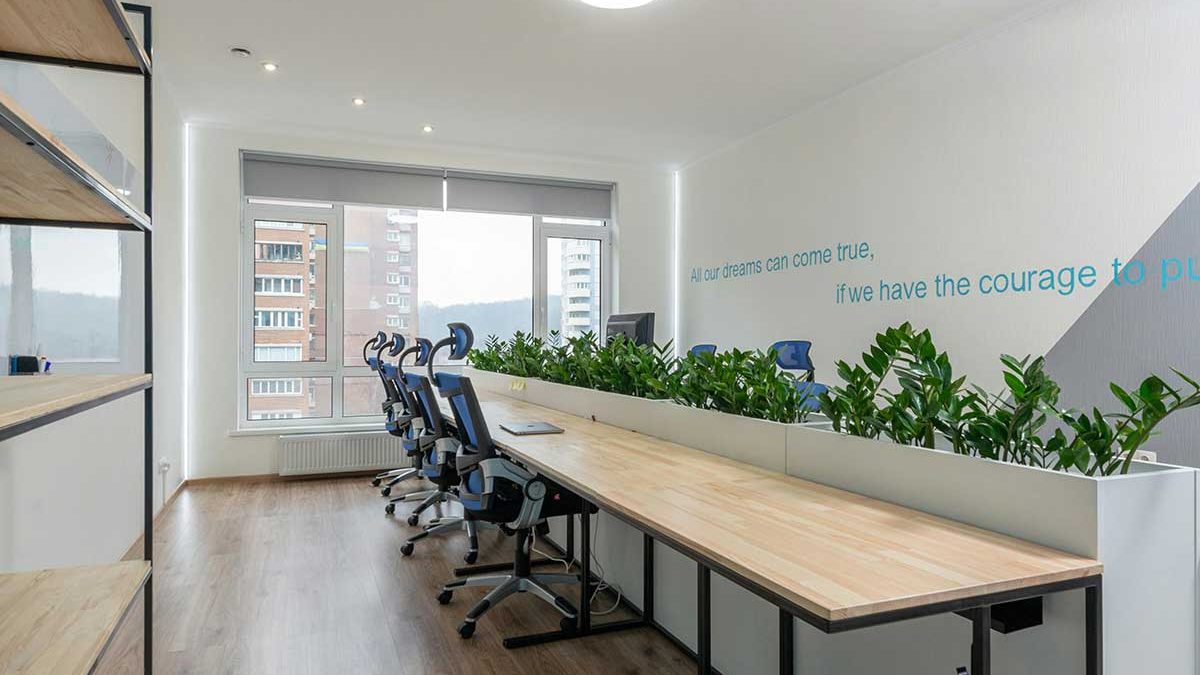 A sleek and modern office space designed for productivity and collaboration, featuring ergonomic chairs and plenty of natural light.