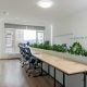 A sleek and modern office space designed for productivity and collaboration, featuring ergonomic chairs and plenty of natural light.